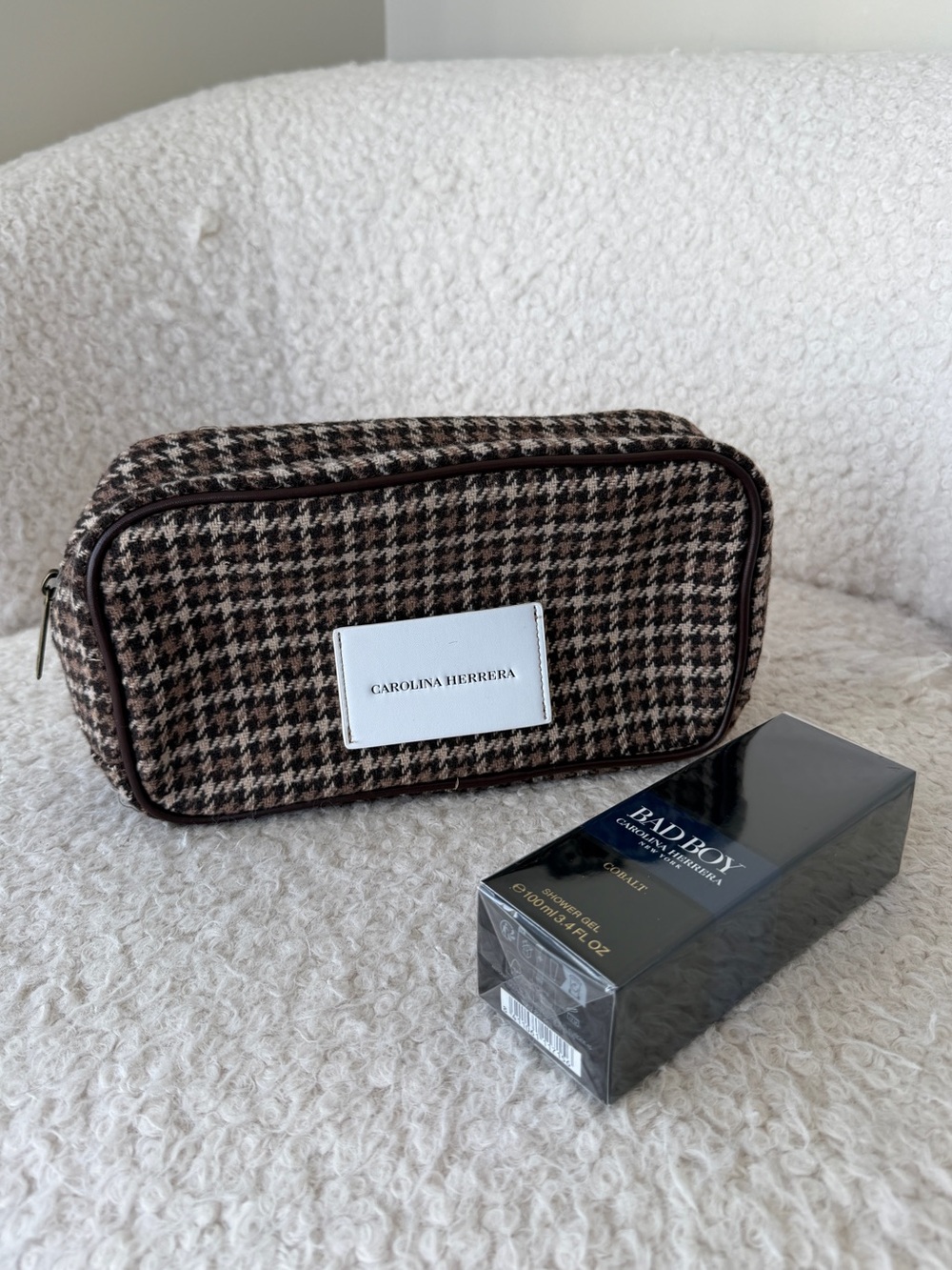 Carolina Herrera Brown cosmetic bag and shower gel